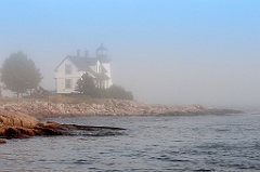 Prospect Harbor Lighthouse on Foggy Rocky Shore in Maine